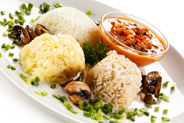 Rice dish with sauce on white background 