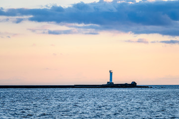 sea ships on the horizon in sunset