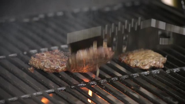 Barbecue burgers on charcoal grill in summer