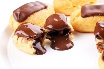 Traditional French dessert. Eclair with chocolate icing. Pastery concept