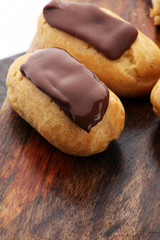 Traditional French dessert. Eclair with chocolate icing. Pastery
