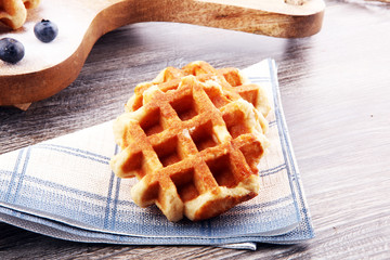 Traditional belgian waffles with fresh fruit and powder sugar