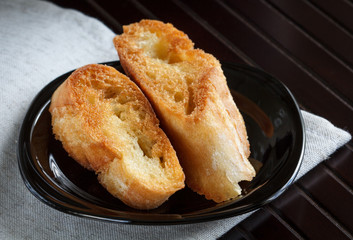 Crispy fried slices of white wheat bread on a plate