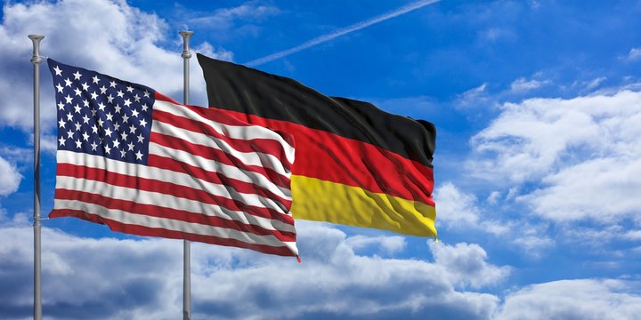 Germany and America waving flags on blue sky. 3d illustration