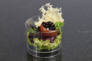 Mini desserts and meat canapes vegetable snacks in plastic cups canapes 