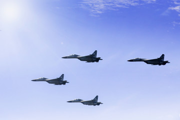 Four jet fighters flying in the sky