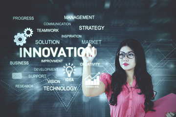 Pretty businesswoman writes innovation text