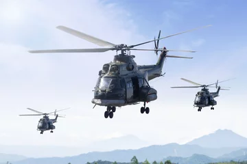 Selbstklebende Fototapeten Three military helicopters patrolling in the mountain © Creativa Images