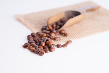 Coffee beans and wooden scoop