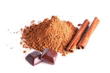 Chocolate pieces, cacao powder and cinnamon