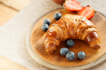 Fresh croissant and berries 