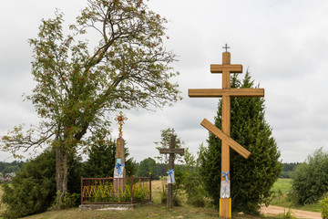 Three decorated orthodox crosses by the road in the the countryside