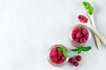 Chocolate dessert with raspberries on a grey concrete, stone or slate background.Top view with space for text.