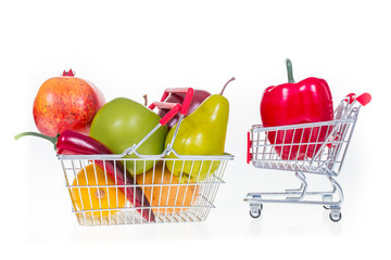 Shopping cart and shopping basket full with fruits and vegetables isolated on white background