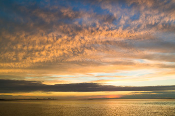 Waddensea with coastlines of island Texel and Den Helder at sunset, Netherlands