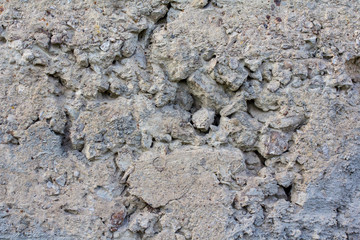 Texture of old plaster with worn grey paint