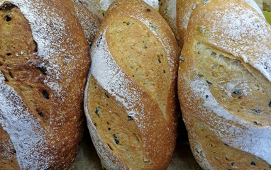 Heap of whole grain bread loaves, Top view for background 