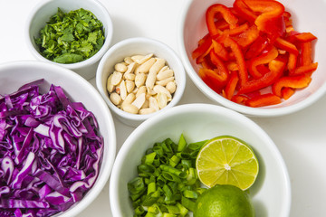 Healthy colorful food chopped produce vegetables recipe ingredients prepared and ready in white bowls background diet lifestyle