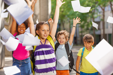 Portrait of a girl and his school friends on back