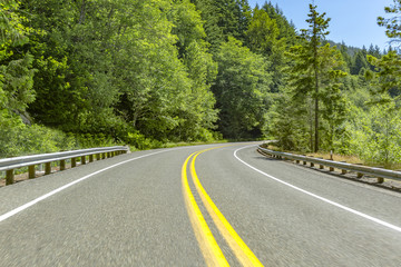 A car perspective driving on a paved road at high elevations in Rainier National Park