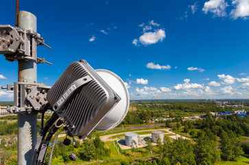 Part of telecommunication tower with outdoor unit of wireless communications system is including...