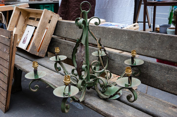 Old chandelier at flea market in Paris (France).