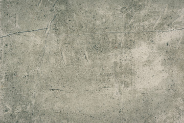Old concrete wall with cracks - vintage grunge toned background, texture