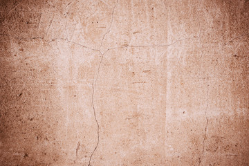 Old concrete wall with cracks - vintage grunge toned background, texture