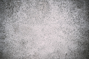Old concrete wall with cracks - vintage grunge toned background, texture