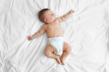 Cute little baby sleeping on bed at home - obrazy, fototapety, plakaty