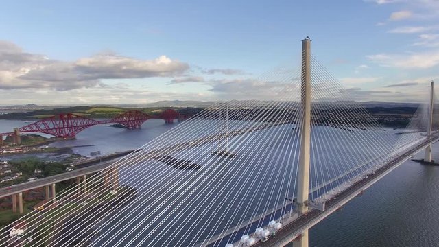 Aerial footage of the newly completed Queensferry Crossing bridge spanning over Firth of Forth Bay. Scotland, UK