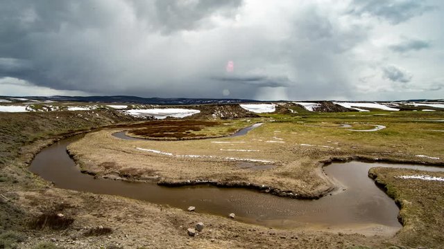 Time lapse of clouds moving over winding river in Hayden Valley Yellowstone