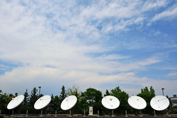 Six Large Satellite Dishes on a Sunny Day
