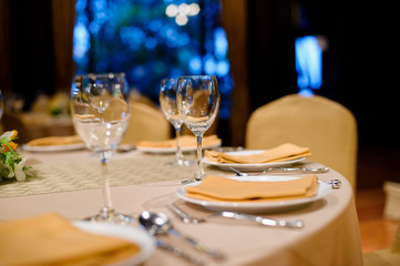 glass wine on table.restaurant glass of water on table / dish and spoon