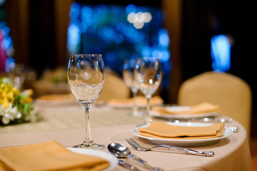 glass wine on table.restaurant glass of water on table / dish and spoon