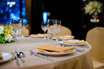 glass wine on table.restaurant glass of water on table / dish and spoon