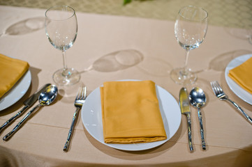 glass wine on table.restaurant glass of water on table / dish and spoon