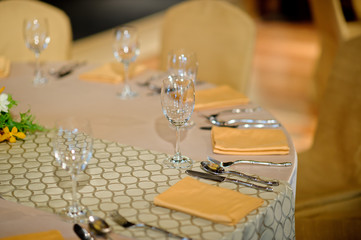 glass wine on table.restaurant glass of water on table / dish and spoon