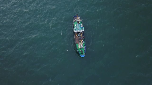 Fishing boat in the Azov Sea at sunset. aerial survey