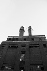 Fototapeta na wymiar smoke stacks on an old factory building