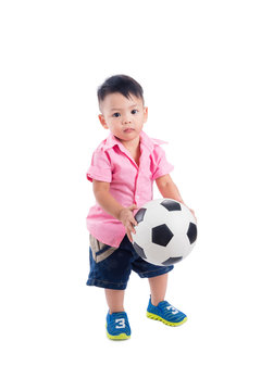 Little asian preschool boy holding ball over white background