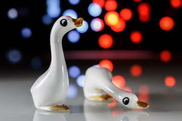 Figurines of white geese