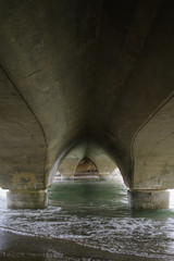 Bridge over water going out into the sea.