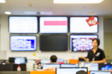 abstract blur focus engineer stand and talk issue problem in Network Operation Center room