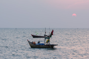 thai fishing boat on the sea after sunset