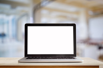 Laptop on wood desk at office background. For Graphic display montage.