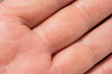 Texture of the skin with wrinkles on the body of mature male