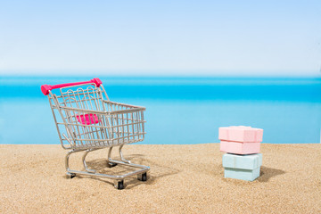 Summer signings, shopping travel. Cart on the beach