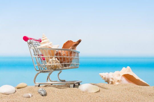 Summer signings, shopping travel. Cart on the beach