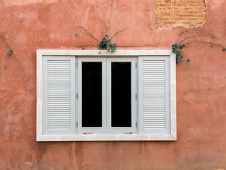 European style window with brick wall background